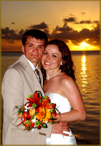 Bride and groom in a warm sunset glow